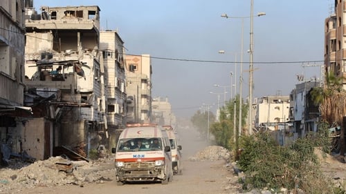 Ambulances transport wounded Palestinians from the Kamal Adwan Hospital to the al-Shifa hospital in Gaza City