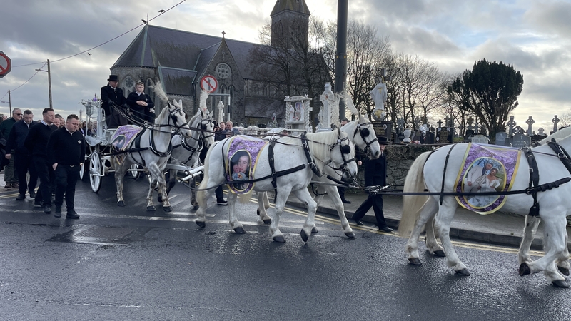The cortege leaves St Mary's Church after the funeral mass
