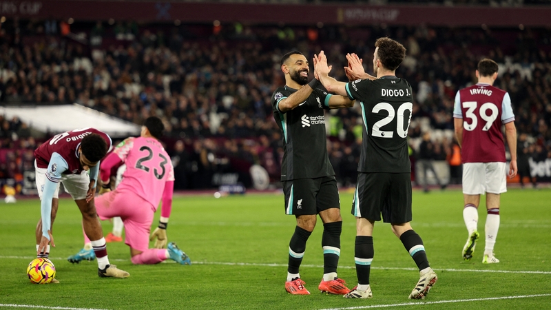 Mohamed Salah (L) and Diogo Jota celebrate Liverpool's fifth goal