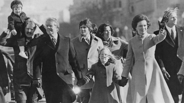 Jimmy, Amy and Rosalynn Carter walk in the inaugural parade in Washington DC on 20 January 1977