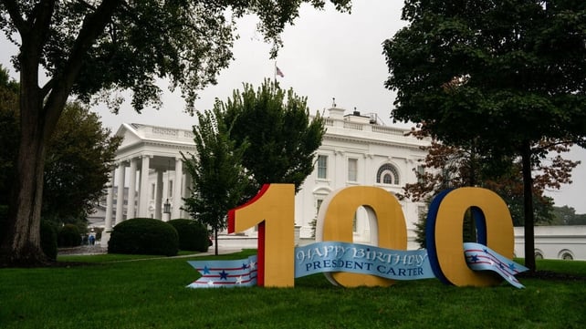 A sign celebrating the 100th birthday of former US President Jimmy Carter last October