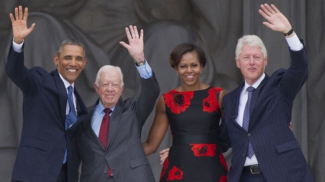 Then-US President Barack Obama, Michelle Obama and former US Presidents Bill Clinton and Jimmy Carter wave during the Let Freedom Ring Commemoration in 2013