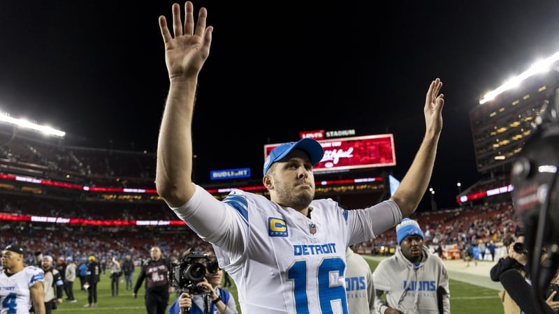 Jared Goff celebrates as he walks off the field following Detroit's win