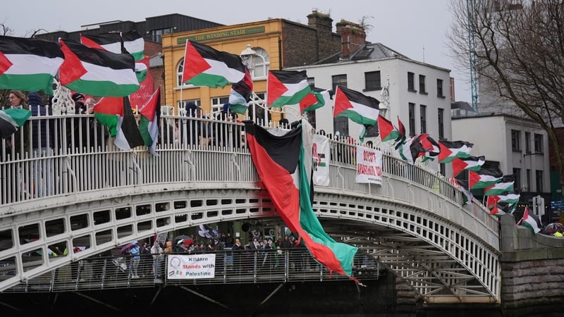 Members of the press gathered for the Irish Palestine Solidarity Campaign New Year's Eve vigil at the Ha'penny Bridge in protest over the killing of journalists by Israeli forces