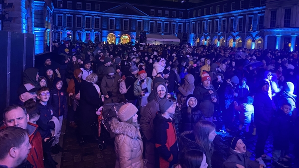 Tourists from across Europe and the US are among the crowds at Dublin Castle this evening