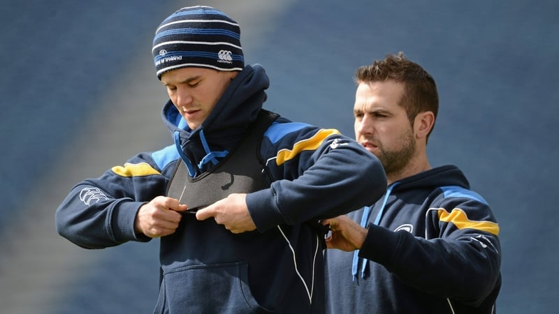 Stephen Smith (right) fits a GPS bib on to Johnny Sexton when he worked for Leinster in 2012