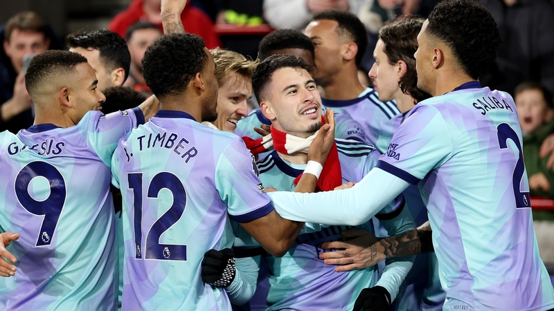 Gabriel Martinelli (scarf on) scored Arsenal's third goal to make things comfortable for the visitors