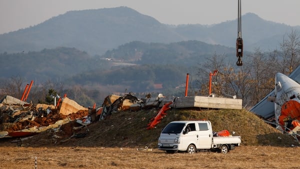 The localizer antenna facility, essential for guiding aircraft landings pictured near the runway at Muan International Airport