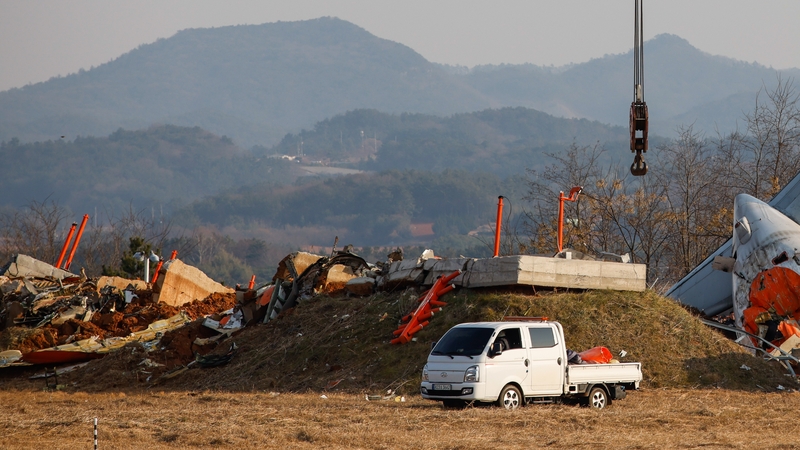 The localizer antenna facility, essential for guiding aircraft landings pictured near the runway at Muan International Airport