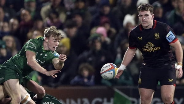 Connacht's Ben Murphy (l) gets a pass away with Ulster's Jack looking on