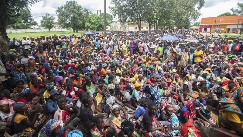 Displaced people gather to receive aid from the World Food Programme in Mozambique