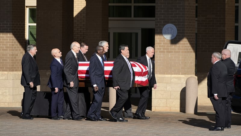 Carter's state funeral officially began with Secret Service agents from his current and former protective detail carrying his casket to a hearse for a tour through Plains, Georgia