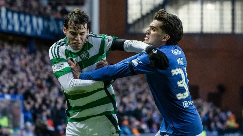 Celtic's Paulo Bernardo (L) and Rangers' Ianis Hagi in action during the Old Firm derby