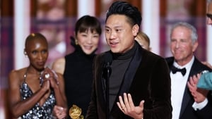 Director Jon M. Chu accepts the Cinematic and Box Office Achievement gong for Wicked