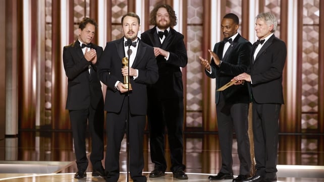 Gints Zilbalodis, Matīss Kaža, Ron Dyens accept the award for Motion Picture - Animated for Flow