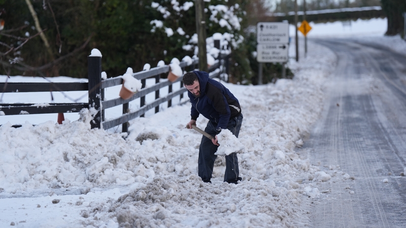 A man clears snow in Towlerton in Co Laois. Photo: PA