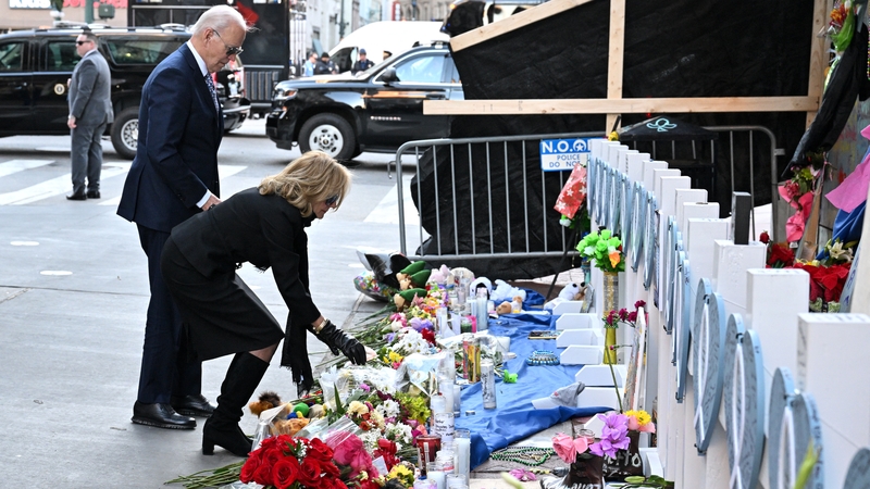 Joe and Jill Biden lay flowers at a memorial to the victims