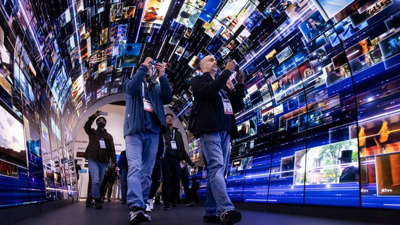 Attendees walk through an installation highlighting LG's smart TV platform at CES this week