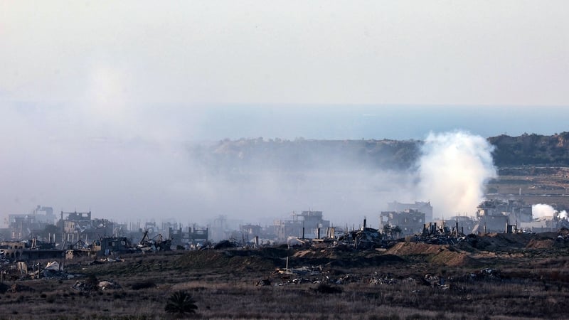 Smoke rises above destroyed buildings in northern Gaza after fresh Israeli strikes