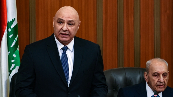 Newly elected Lebanese president Joseph Aoun stands next to the parliament speaker Nabih Berri as he delivers a speech at the parliament building in Beirut