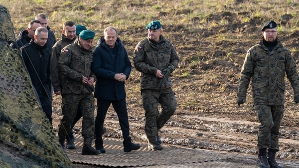 Polish Prime Minister Donald Tusk (centre) visiting a section of the 'East Shield', a defensive infrastructure along Poland's borders with Russia and Belarus