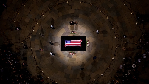Donald and Melania Trump pay their respects in front of the flag-draped casket of former US President Jimmy Carter at the Capitol Rotunda in Washington
