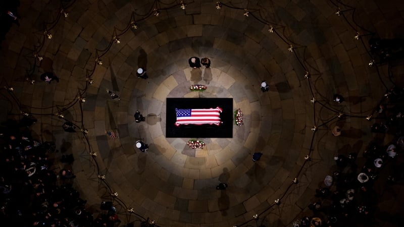 Donald and Melania Trump pay their respects in front of the flag-draped casket of former US President Jimmy Carter at the Capitol Rotunda in Washington