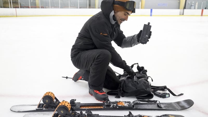 CES 2025 - SKIMO's Nicola Colombo with his electric assisted skis at Hylo Park Ice Arena in Las Vegas