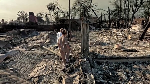 The Foster family visited the ruins of their home following the devastating fires
