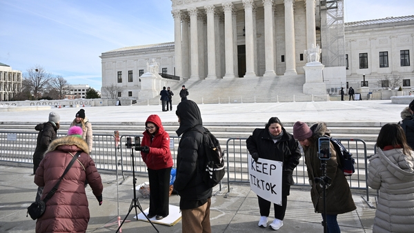 Supporters of Tiktok livestream in front of the US Supreme Court in Washington, DC