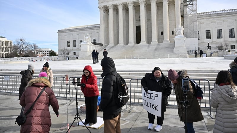 Supporters of Tiktok livestream in front of the US Supreme Court in Washington, DC