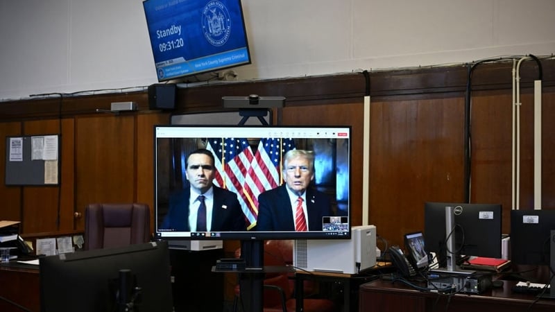 Donald Trump appeared with his lawyer on TV screens beamed to the courtroom