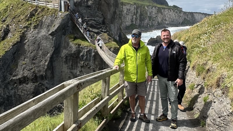 Tourism operator Ken Delaney (right) with a client visiting Carrick-a-Rede Rope Bridge