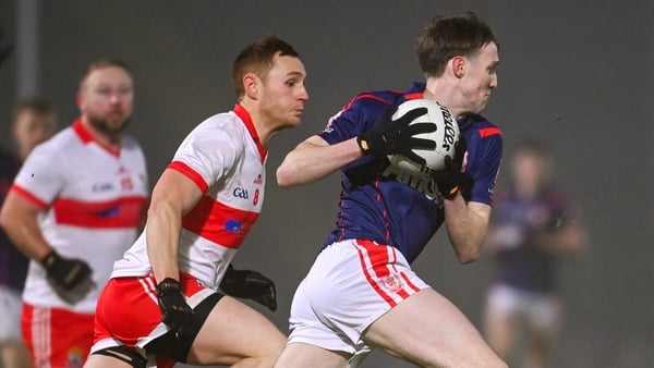 Eoin Kennedy of Cuala in action against Kevin Banks of Coolera-Strandhill