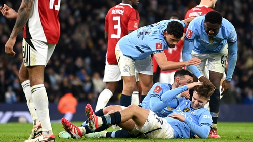 Manchester City players mob hat-trick hero James McAtee