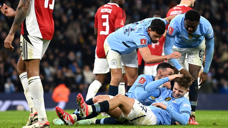 Manchester City players mob hat-trick hero James McAtee