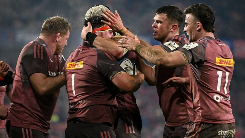 Dian Bleuler (number 1) is congratulated after scoring Munster's first try