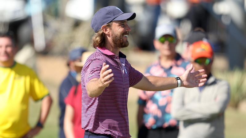 Tommy Fleetwood celebrates after sinking the winning putt