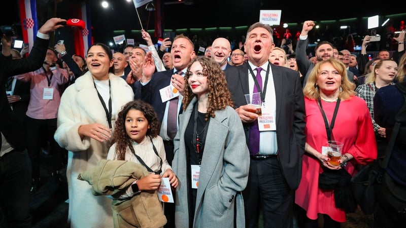Supporters of Croatia's outgoing President and presidential candidate Zoran Milanovic celebrate after the first exit poll results