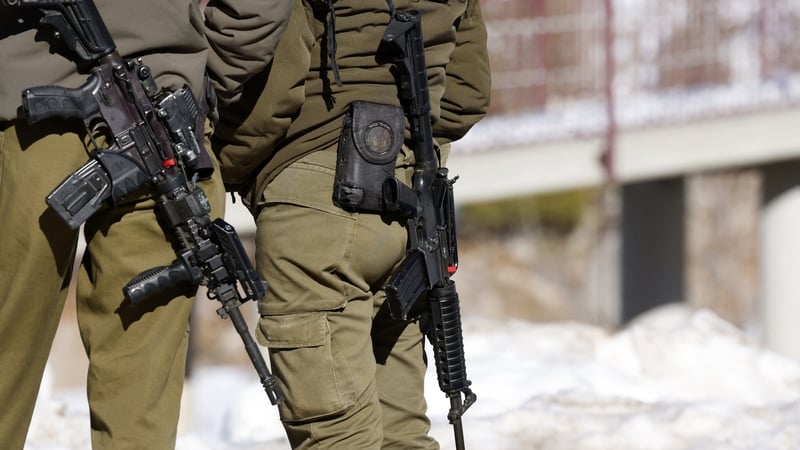 Israeli soldiers stand guard at the Hermon ski resort, bordering Syria and Lebanon, during a media tour organised by the Israeli army on 8 January