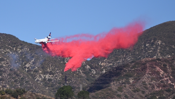 The substance, vivid against the grey smoke and charred landscape, is fire retardant, much of it a product called Phos-Chek that has been used by the US Forest Service since the 1960s