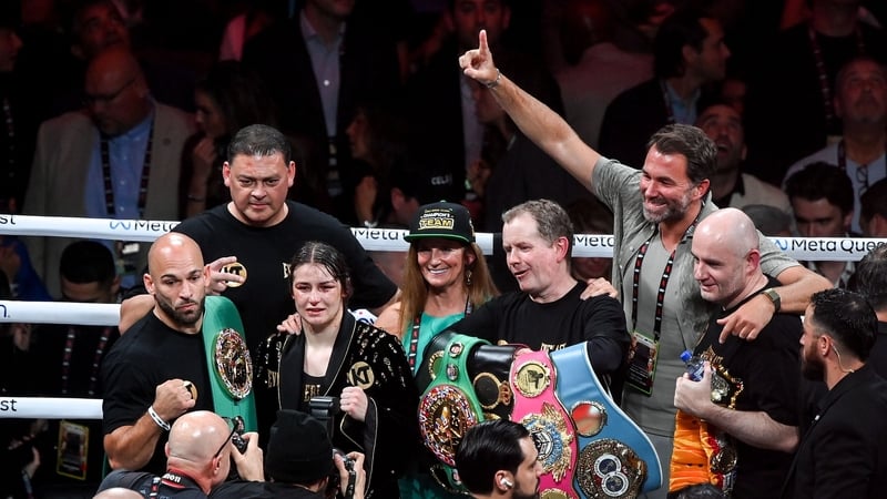 Katie Taylor's team celebrating the second victory over Amanda Serrano last November