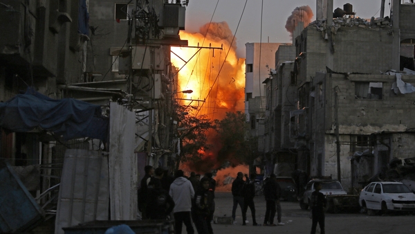 Smoke rises from a building destroyed in an Israeli airstrike at the Bureij camp for Palestinian refugees in central Gaza