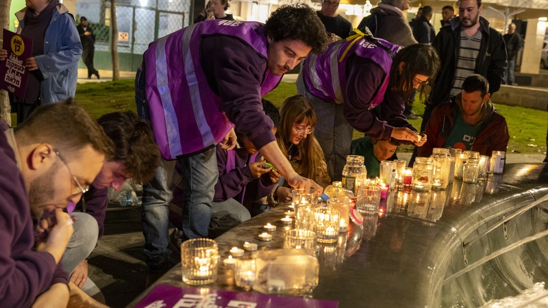 Protesters light candles for the hostages taken by Hamas and those killed in the war during a demonstration for a ceasefire in Jerusalem, Israel