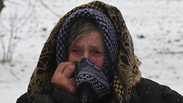 Yaroslava Sukach, 77, cries as she looks at her destroyed home following a missile strike on the village of Sknyliv, Ukraine