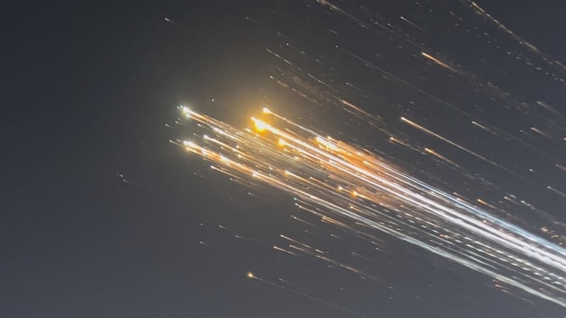 Orange balls of light fly across the sky as debris from the SpaceX rocket is spotted over Turks and Caicos Islands