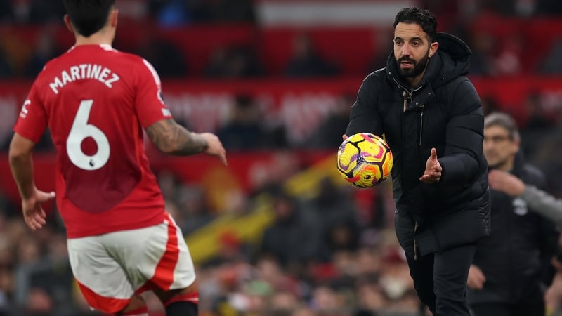 Ruben Amorim throws the ball to Lisandro Martinez during the Southampton game