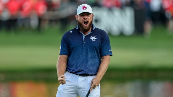 Tyrrell Hatton celebrates on the 72nd after sealing victory in the Dubai Desert Classic