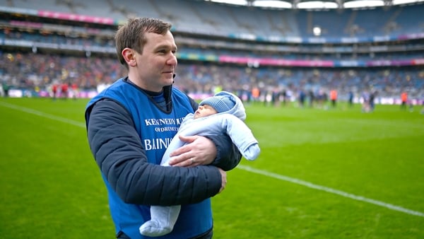 Na Fianna manager Niall Ó Ceallacháin celebrates with his son Alfie after his side's victor