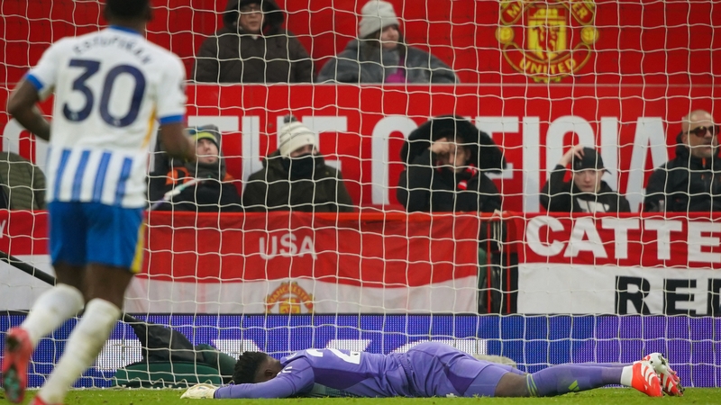 Andre Onana lies prone on the Old Trafford pitch after conceding Brighton's third goal